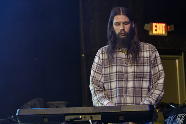 Tom Kolarik (keys and bass) playing at the Mayhem 5.