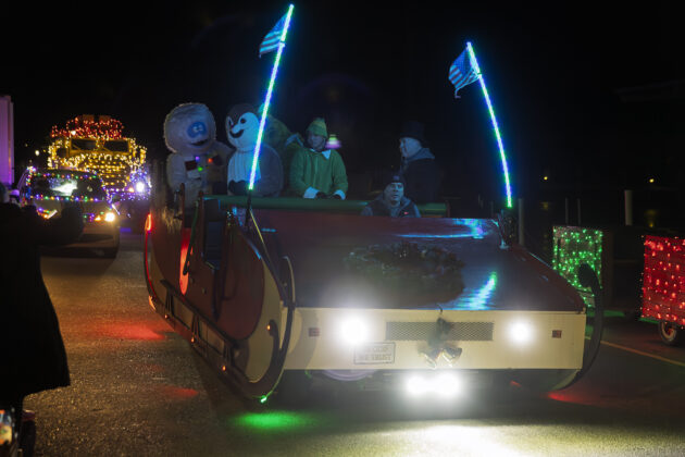 Large sleigh with Mayor Kip C. Walby and many other Christmas characters at the Santa Parade.