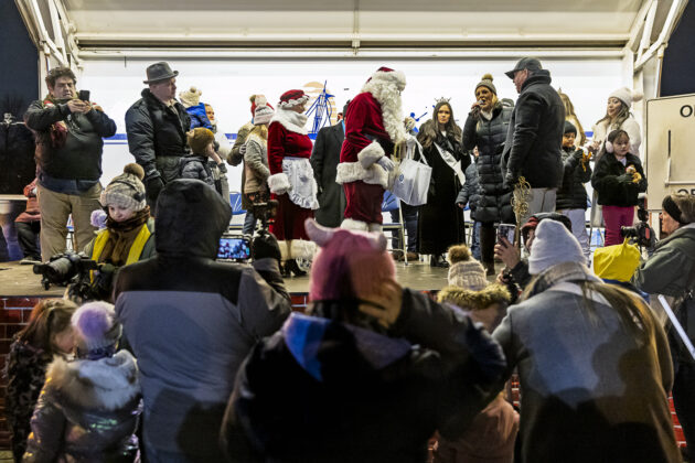 Santa receiving letter written by the children