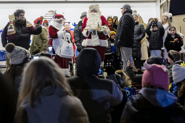 Santa receiving the key to the city.